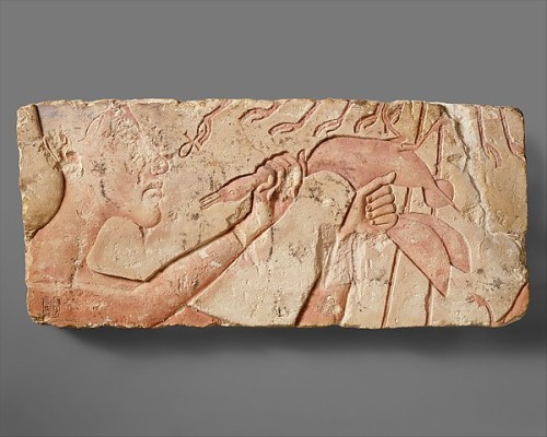 ancientpeoples:Limestone slab showing king Akhenaten sacrificing a duck to the sungod Aten The sungo