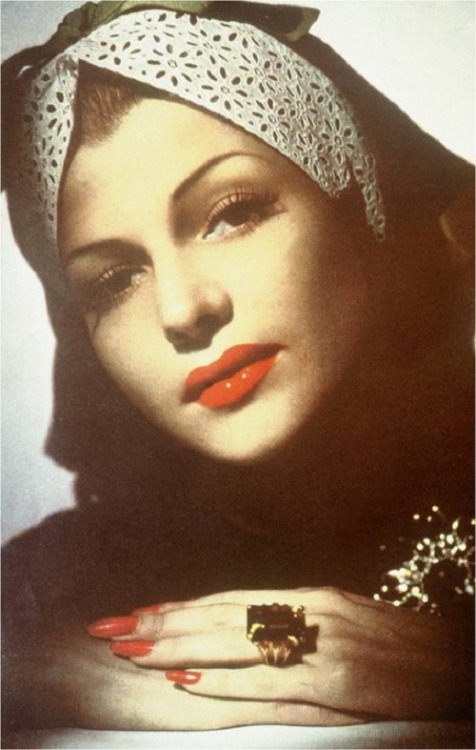 gatabella:Rita Hayworth wears a Verdura ring and brooch in the January 1943 issue of Town & Country