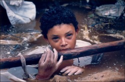 purrge:  The 13-year-old Colombian girl was caught in the eruption of Nevado del Ruiz. She was caught in an image by Frank Fournier, shortly before she died. Omayra had been trapped for three days in the ruins of her home, the Red Cross requested help