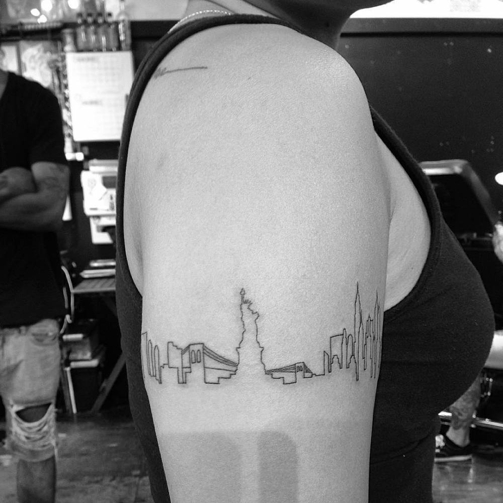 NYC skyline tattoo located on the inner arm fine line