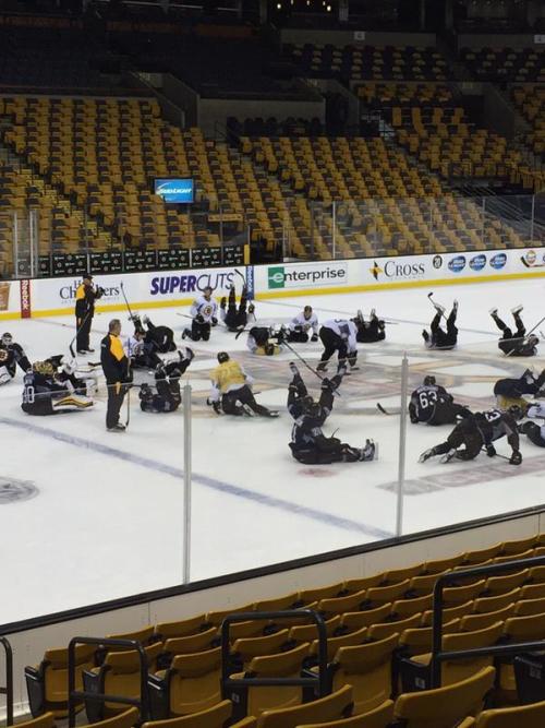 The Boston Bruins pause practice for a yoga break. (x)