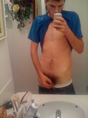 undie-fan-99:  Guy showing off in (what appears to be) his white Hanes boxerbriefs.
