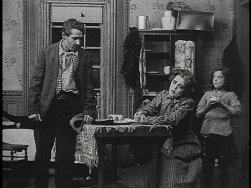 Henry B Walthall, Marion Leonard and Gladys Egan inA Trap for Santa Claus (1909)Director: DW Griffit