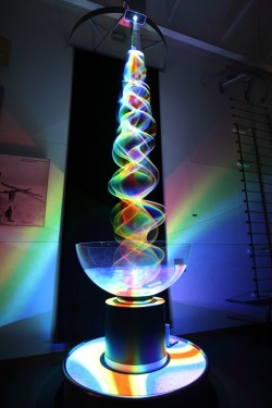 shinyslingback:  Spectrum of Colours Revealed Through Lit String British artist, physicist, and all-around science enthusiast Paul Friedlander produces kinetic light sculptures that provide a colourful feast for the eyes. Each piece in his body of work