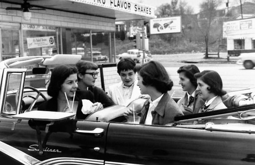 Girls at the drive-in in their 1956 Ford Fairlane Sunliner / photo by Nina Leen, 1957.