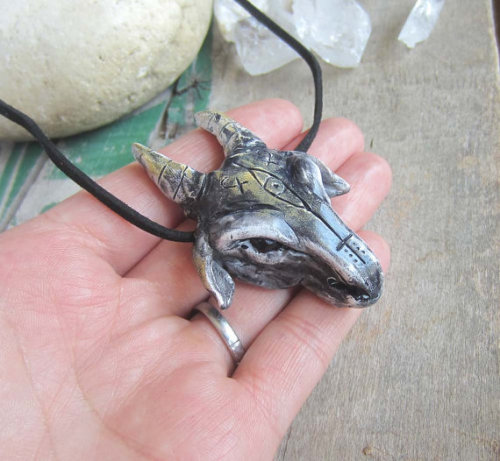 Goat’s Head Pendant with Garnet stones for eyes.