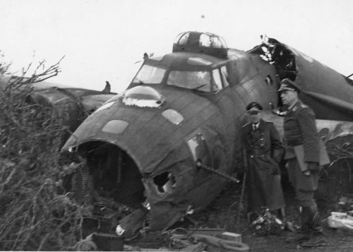 Luftwaffe officers are inspecting the wreck of B-17