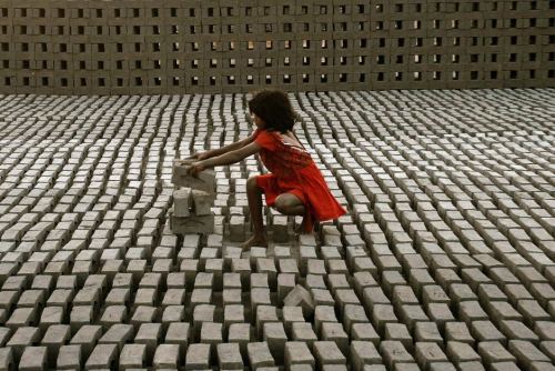 letswakeupworld:  A young girl stacks bricks adult photos