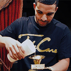 kathybethterry:  Drake doing shots out of his Grammy for Best Rap Album 