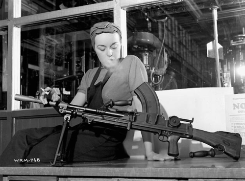 historicaltimes:Veronica Foster, known as “The Bren Gun Girl,” poses with a finished Bren gun at the