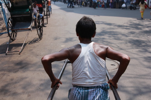 The view from behind - a pull rickshaw driver leads us through the streets of Kolkata. 