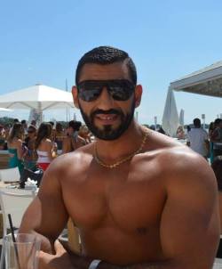 Muscular arms, nice pecs, awesome beard -