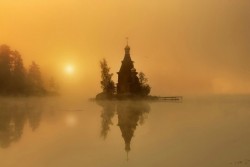 sixpenceee:  On a tiny island in a lake in Russia exists a tiny little church waiting to be discovered. It’s located near St. Petersburg, and close to the border with Finland. It appears in the woods, with its gold top, like something right out of a