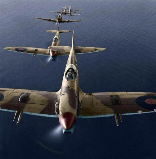 South African Spitfires fly in a loose formation over the Adriatic Sea, on a bombing mission to the 