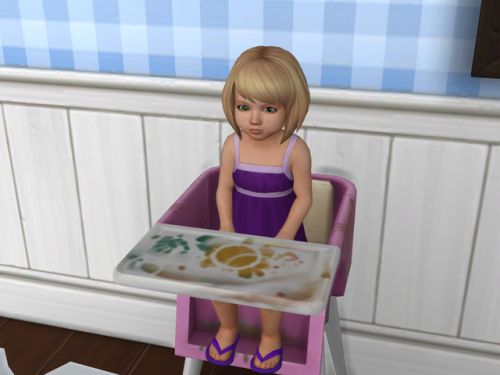 She knocked her food off again!  DOES THIS GIRL NOT WANT TO EAT