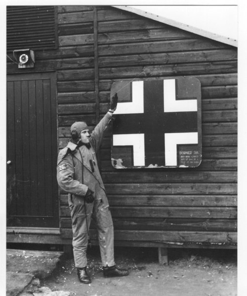 ironwarriors:  “British pilot Barrie Heath of No. 611 Squadron RAF posing with a piece of downed German aircraft, 1941″