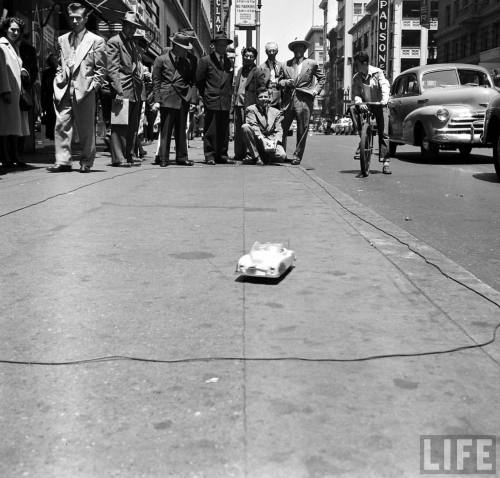 Demonstrating a remonte control toy car(Michael Rougier. 1949)