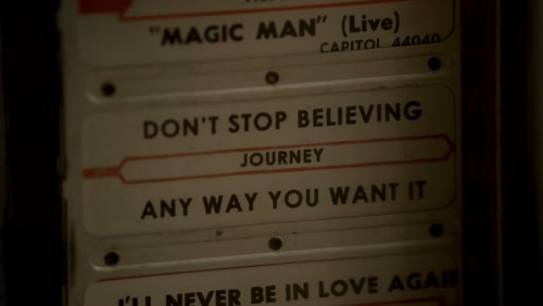 In the final scene, when Tony plays Journey on the tabletop jukebox, yet he sees the same “A L