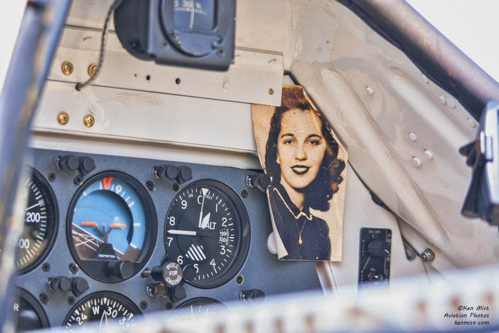 youlikeairplanestoo:  A little inspiration in the cockpit. I wonder who she is …
