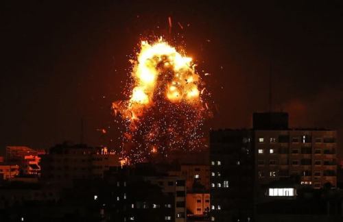 muhammadsmiry: Gaza tonight. Let the world witness the moment israeli warplanes bombed a PRESS build