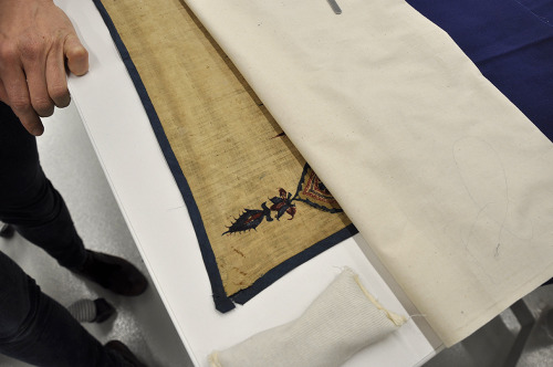 It takes a team of conservators and hours of meticulous preparation and care to get a textile ready 