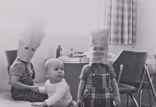 vintageeveryday: Children playing with paper bags, ca. 1960s.