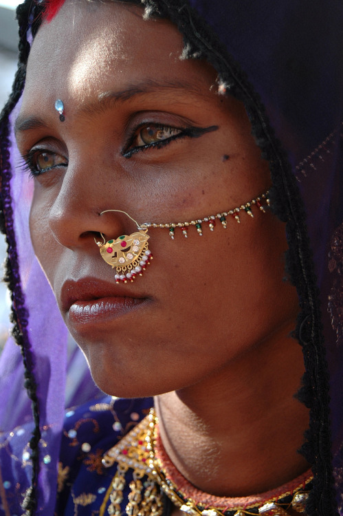 mahakami: The Famous “Pushkar Lady”Papu is a woman from a tribe in Rajasthan, India. She