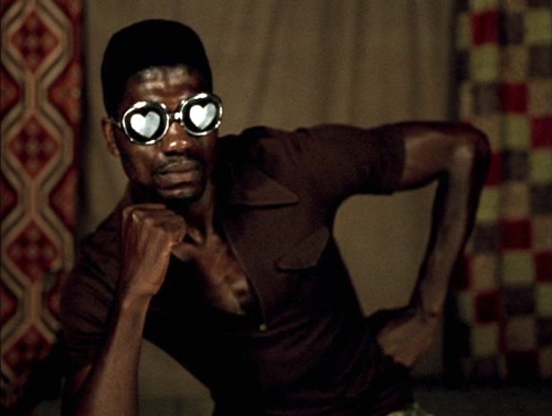 cinememory:  top: Janet Jackson video: ‘Got ‘til It’s Gone’ (1997, dir. Mark Romanek, DOP Jeff Cronenweth) bottom: Samuel Fosso, Untitled, ca. 1977
