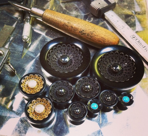 onetribeorganics:
“Finishing up a small army of inlays today. These are standard Basilica plugs with brass + pearl in Ebony, Basilica Shadow (black on black) and La Belle flowers.
”