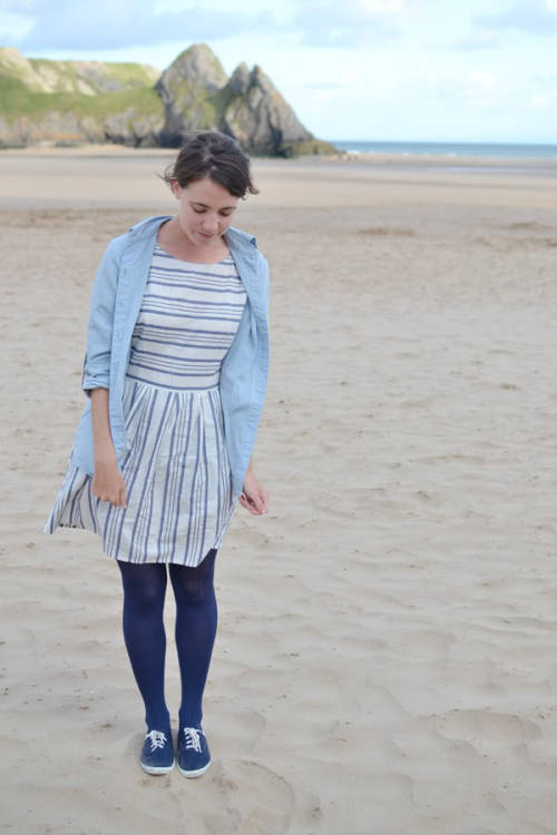 Navy blue tights and shoes with striped white dress and denim shirt