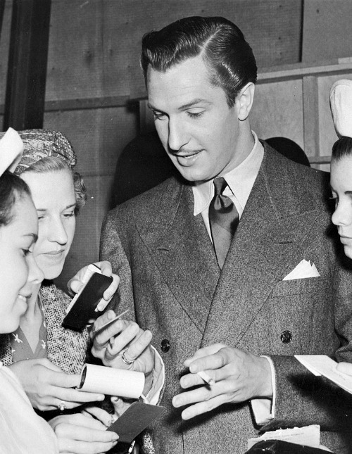 talentspast:   Vincent Price signs autographs for a group of female admirers  on