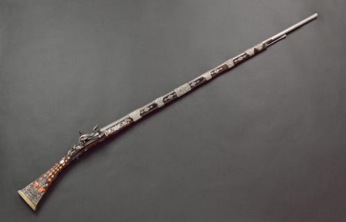 A silver and coral mounted miquelet musket originating from North Africa, early 19th century.