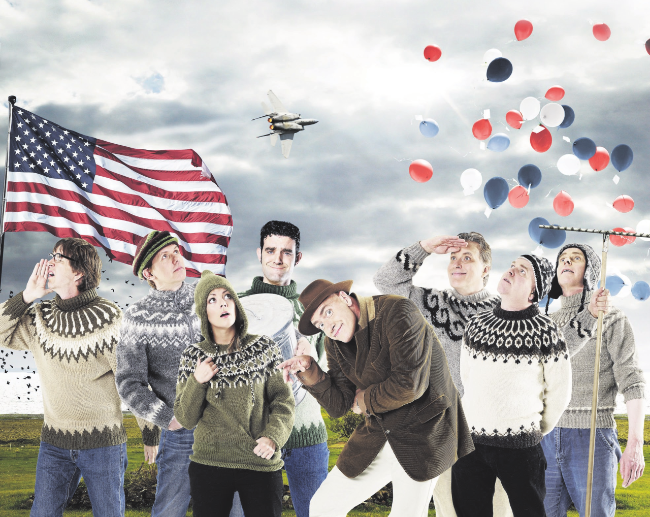 Cover of Stuðmenn's tour in 2006 with the whole band at a field dressed in Icelandic sweaters with an american flag, a military aircraft and balloons in the colors of the American flag is in the sky