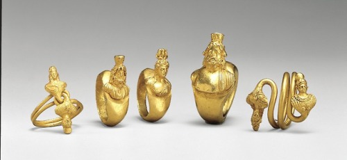 jeannepompadour:Five rings with busts of Ptah and a female consort, Serapis and Isis; 1st–2nd centur