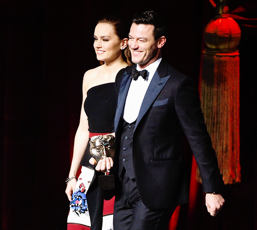 Daisy Ridley and Luke Evans presenting the Best Visuals Award at the 70th EE British Academy Film Aw