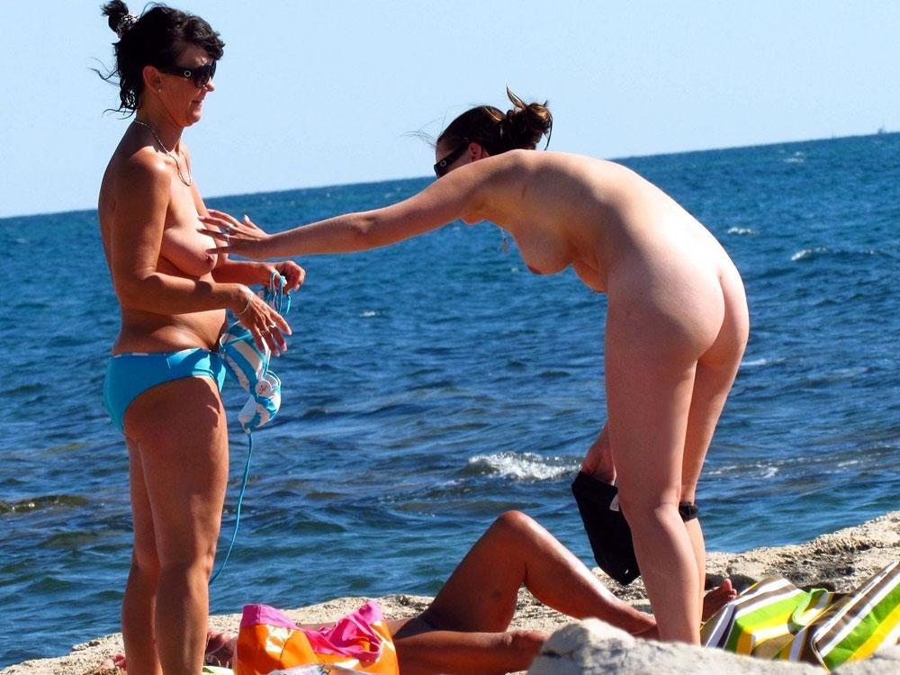 real-naturist-beach:  Mother and daughter undressing on a nude beach