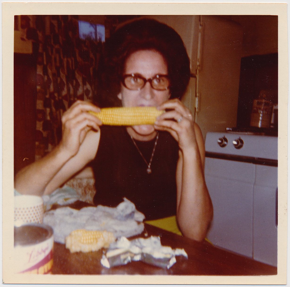 publiccollectors:  Summer fun! An undated photo of an unidentified woman eating corn,
