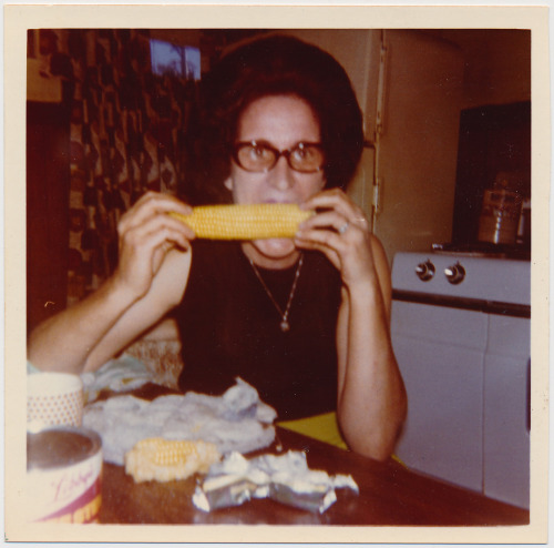 publiccollectors:  Summer fun! An undated photo of an unidentified woman eating corn, from a photo a