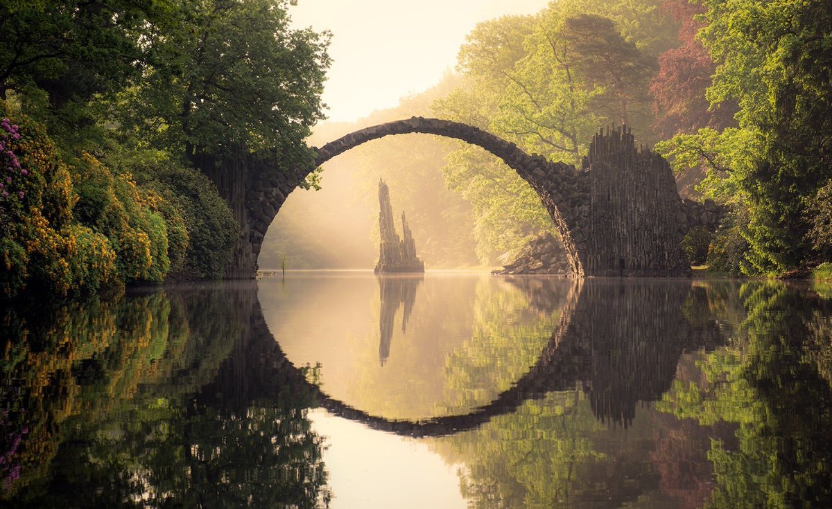 burntcopper: Kromlau bridge, Germany, during all four seasons.