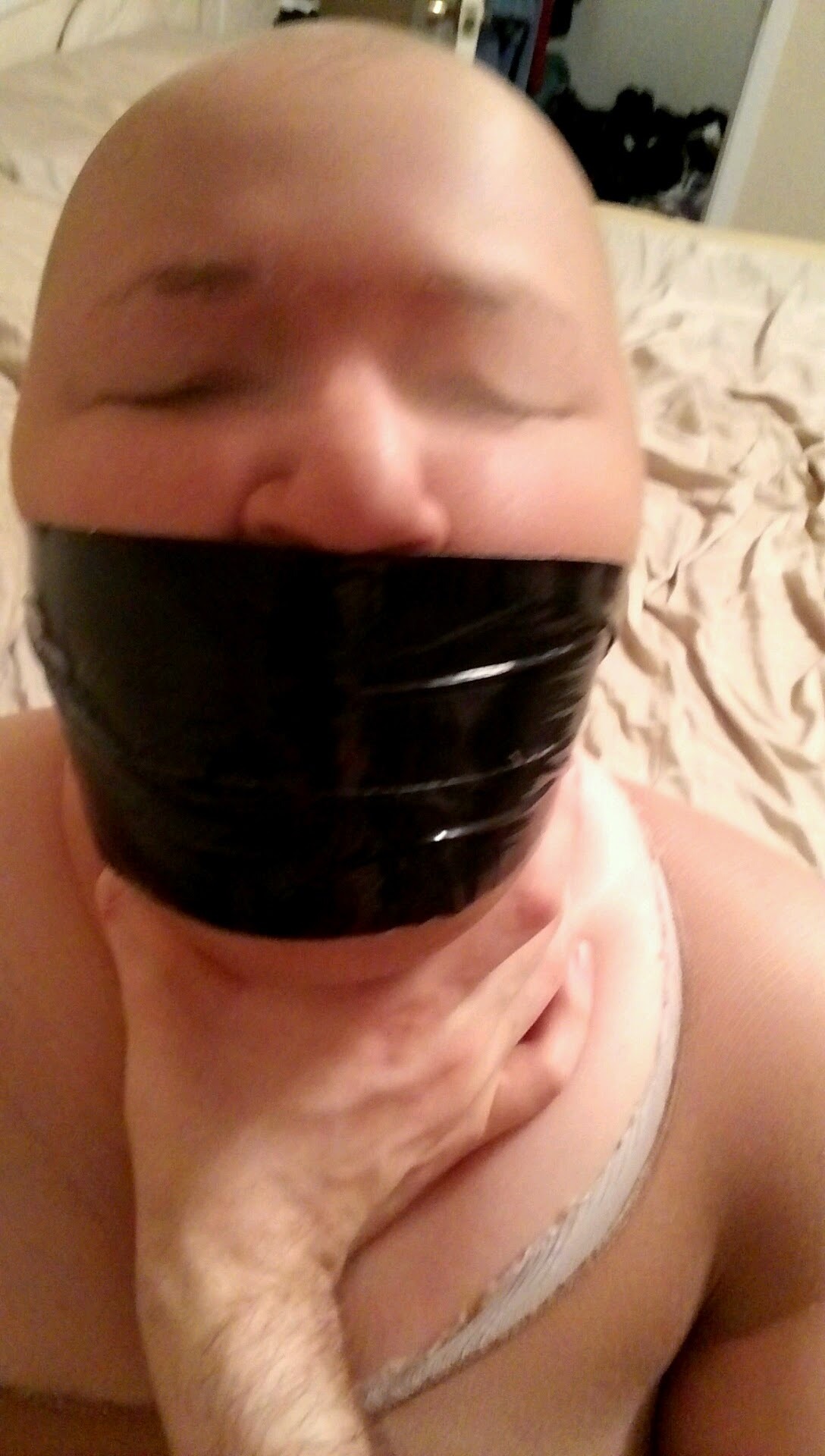 bpcouple:  Been a while so here. Subby gagged and hooded.  Nice tape gag!