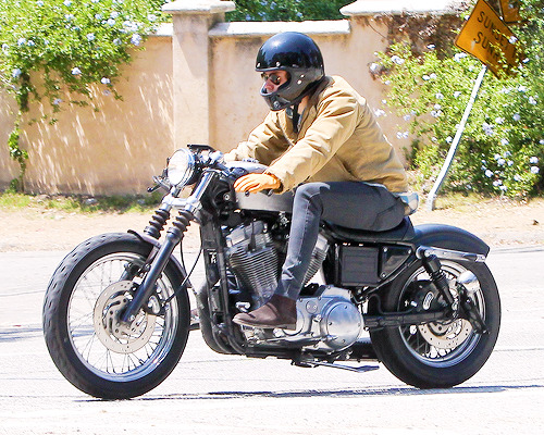 XXX harrystylesdaily:  Harry Styles riding around photo