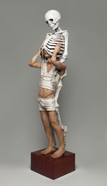 sixpenceee:  The bizarre art of Yoshitoshi Kanemaki. He chisels these life-sized figurative sculptures out of giant pieces of camphor wood, a kind of evergreen. The strange pieces frequently involve two or more characters merged into a single form, which