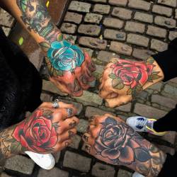 tattoofilter:  Matching traditional style rose tattoos on the hands. Tattoo artist: Matt Webb 