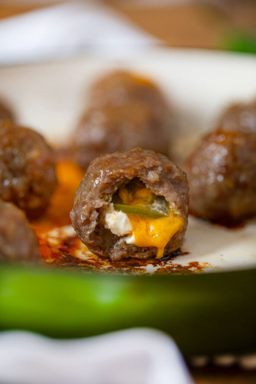 Jalapeno Popper Stuffed Meatballs stuffed with cheddar cheese, cream cheese and jalapenos are two de