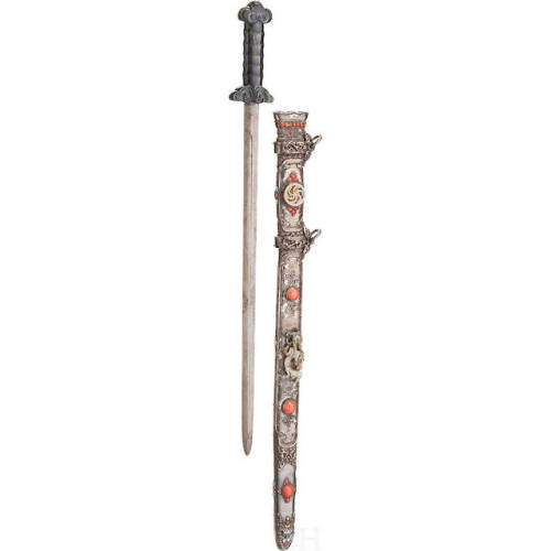 Tibetan sword with jade hilt, silver and red coral mounted scabbard, 19th century.from Hermann Histo