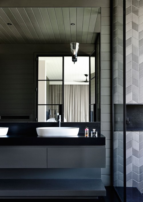 {Australian firm Canny Architecture went for a modern barn kind of aesthetic in this home, with dark