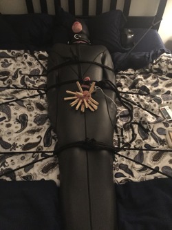 Bondage session late Tuesday night/early Wednesday morning.In a neoprene sleepsack, butt plug in hole, pegs on balls, electro torture on cock, collar on.