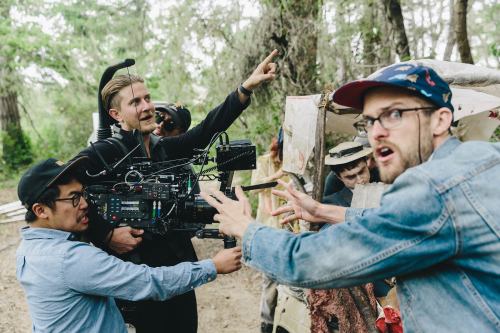 DirectorsDan Kwan and Daniel Scheinert with Paul Dano and Daniel Radcliffe while filming Swiss Arm