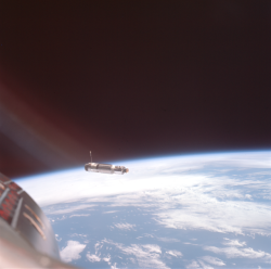 humanoidhistory:  High above Earth, the Agena target vehicle gets closer and closer to the Gemini 8 space capsule, March 16, 1966. (NASA/ASU)