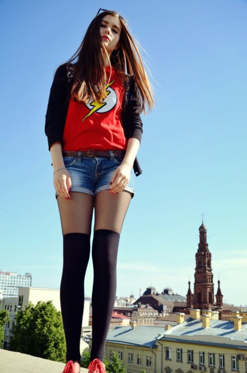 MissKittin2:Above the whole citySexy woman in black pantyhose, tight denim short and knee high socks